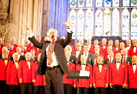 Haydn James leads community singing at Commonwealth Carnival of Music